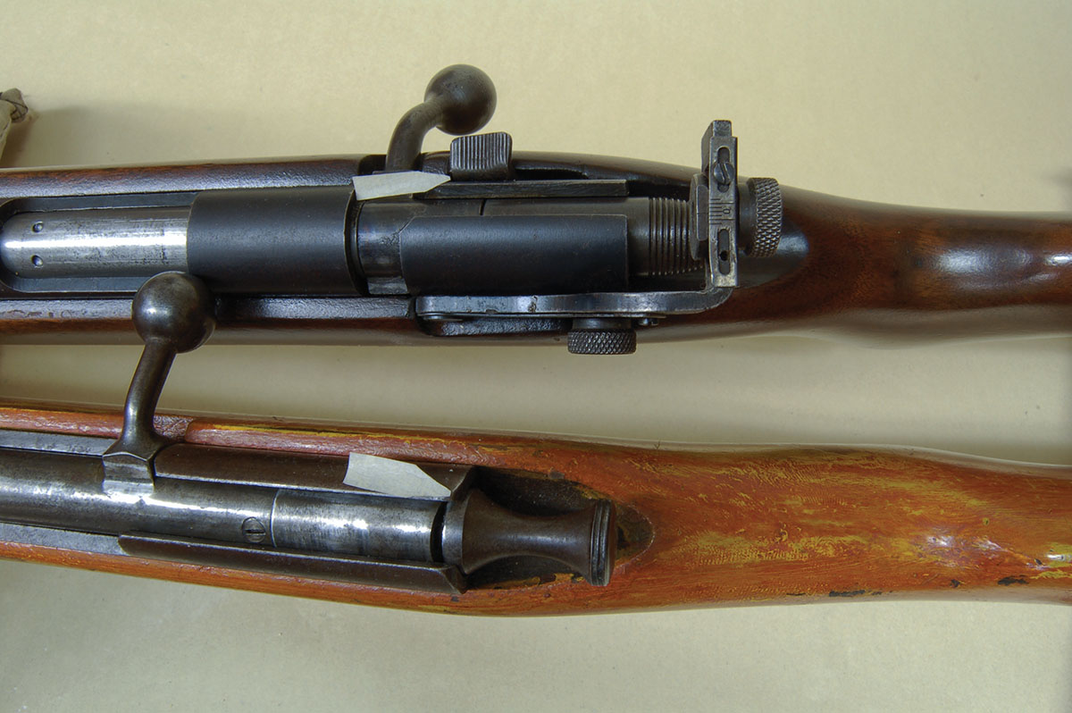 Other single-shot rifles had automatic safeties (see arrows) like the Rem M510 (top), but were stamped sheet metal. The Model X (bottom) was made of case-hardened steel. It will last forever.